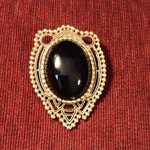 Gold-Tone Filigree Brooch with Black Oval